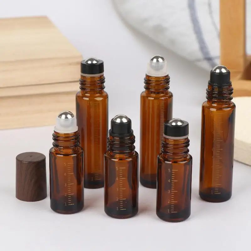 Latest 5ml 10ml Amber Clear Glass Roll On Bottles Plastic Wood Grain Cap Sample Roller Ball Vials For Essential Oil Perfume