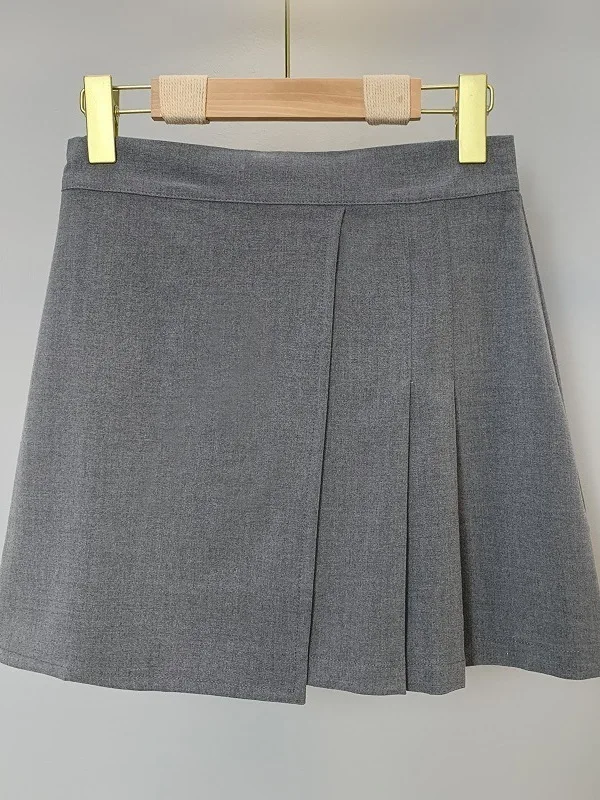 Wiosna/lato wersja koreańska nowa jednolita, wąska plisowana spódnica z wysokim stanem damska kopertowa krótka spódniczka w kształcie litery A D729