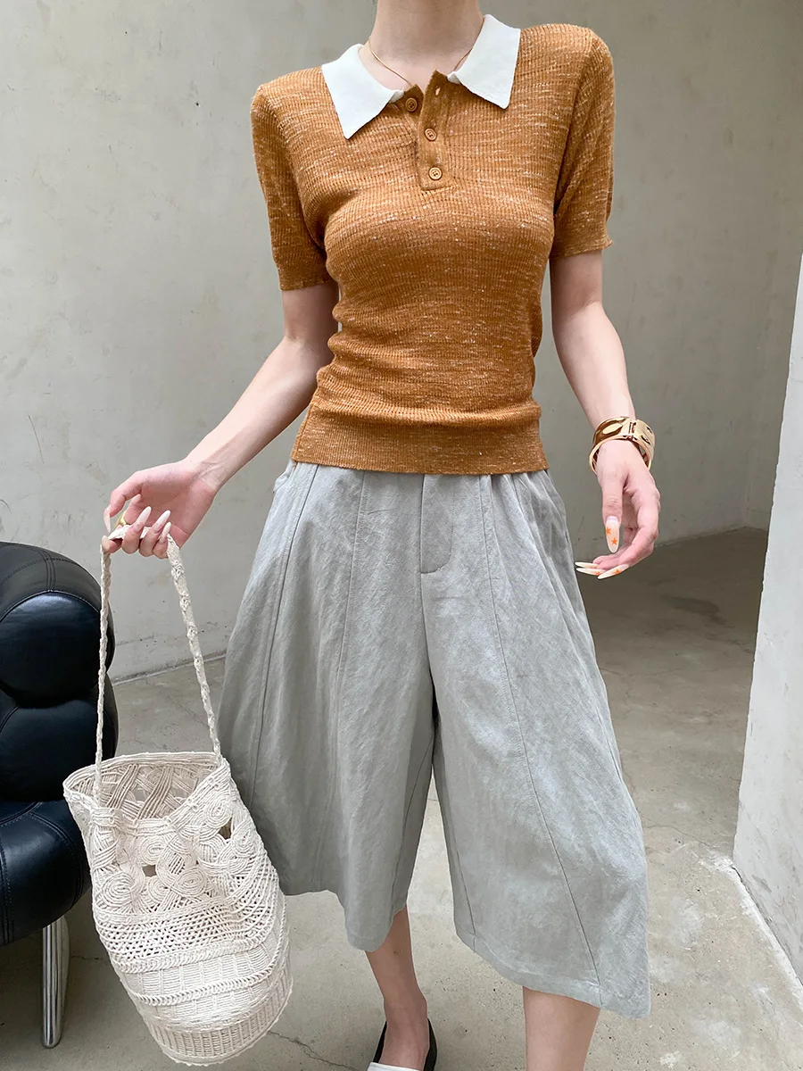 Sommerliche Damen-Freizeithose in einfarbigem Design mit lockerem Schnitt und hohem Bund und weitem Bein. – Detail 21