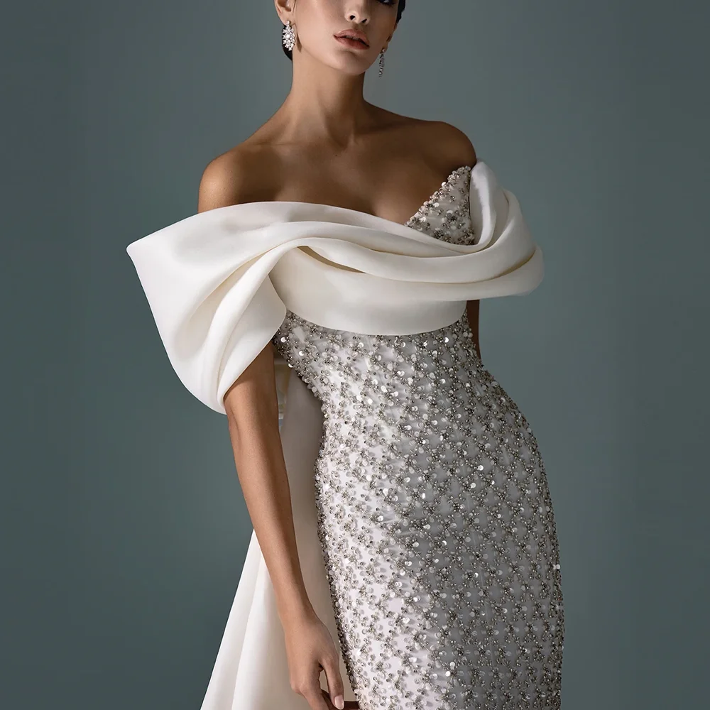 ชุดราตรี MANRUIXIN สีขาวแบบเปิดไหล่ ประดับลูกไม้และเลื่อมวิบวับ หรูหราสั่งตัดได้ พร้อมผ้าคลุมไหล่สำหรับงานเลี้ยง