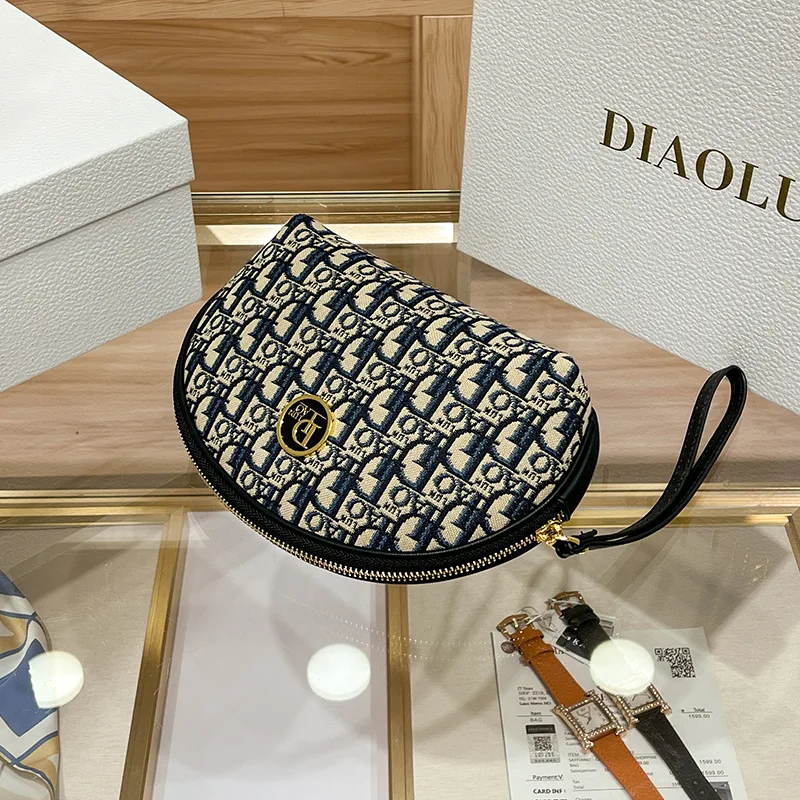 2023 Spring/summer new grip bag advanced sense embroidery printed makeup bag canvas texture hand purse M894