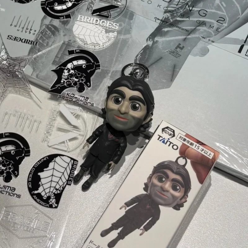TAITO Death Stranding 2 Dollman Talking Figure Keychain Collectible Game Character Pendant Accessory For Death Stranding Fans