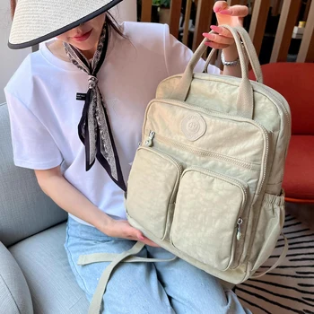 Sac à dos multi-poches pour femmes, sac à dos de voyage en Nylon de couleur unie à poignée souple, léger et décontracté, pour l'école