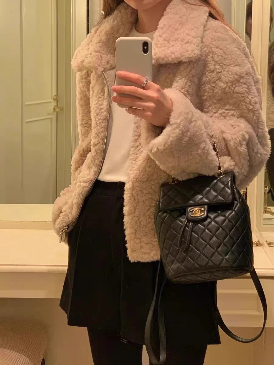 Calore e Sle: Jaet da donna in pelliccia di agnello ort con colletto rialzato di Dongda Gate OUCE Gentle Sle Loose Fit Long Sve