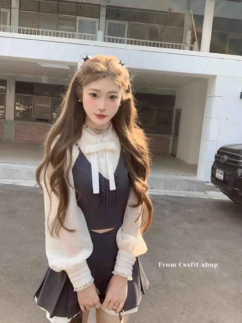 

Korean Fashion Bow Lantern Sleeve Shirt+solid Color Suspender Vest+high Waist Slimming A-line Pleated Skirt Set of Three