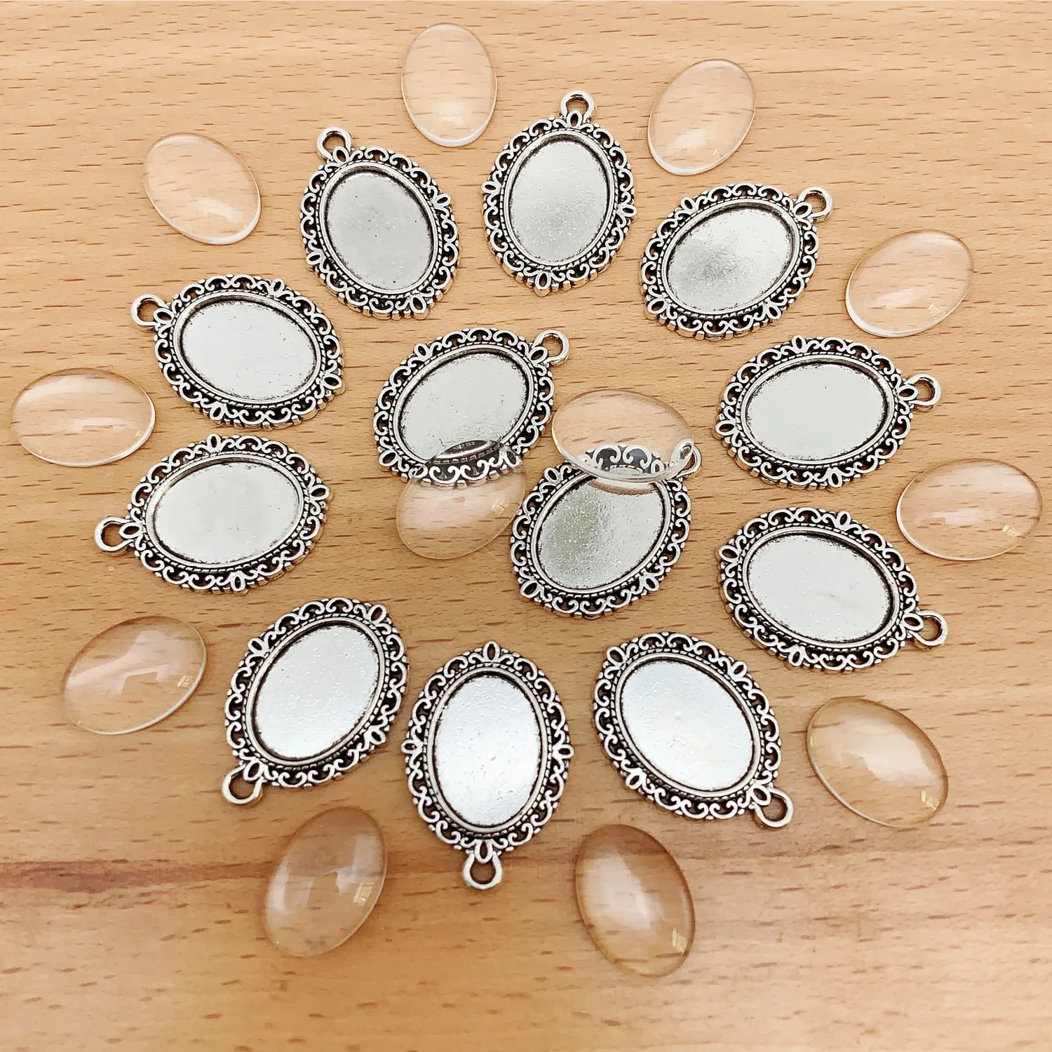 A set of 12pcs Alloy Inner 10x14mm/13x18mm/18x25mm Oval Lace Bottom Pads with Transparent Glass Patches for DIY Jewelry Making