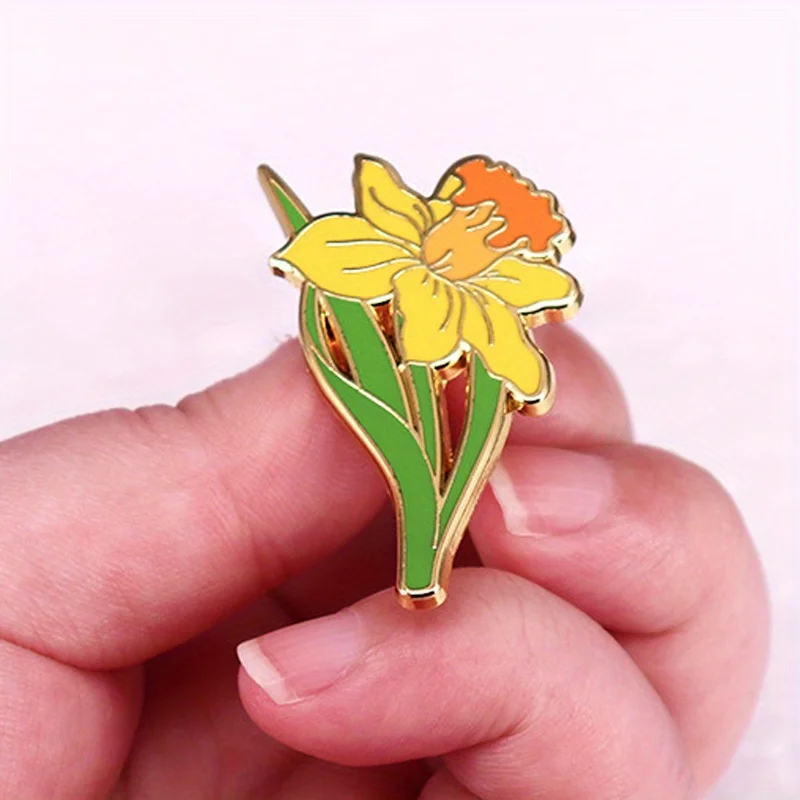 Giallo narciso spilla pianta erbacea fiore emblema accessorio zaino decorazione abbigliamento