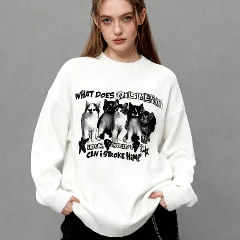 

Super sized knitted sweater with cute cat pattern print, unisex avant-garde streetwear aesthetic. What does this mean for slogan