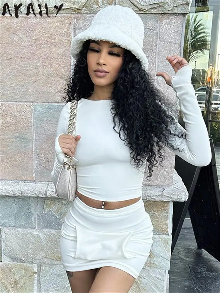 

Akaily Sexy Long Sleeve Crop Top Pocket Skirt Set Vacation For Women 2023 Autumn White Bodycon 2 Two Piece Mini Skirts Set