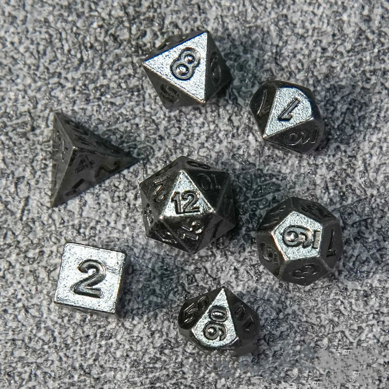 Metal solid mini 5mm multi-faceted dice set for Cthulhu and D&D tabletop games.