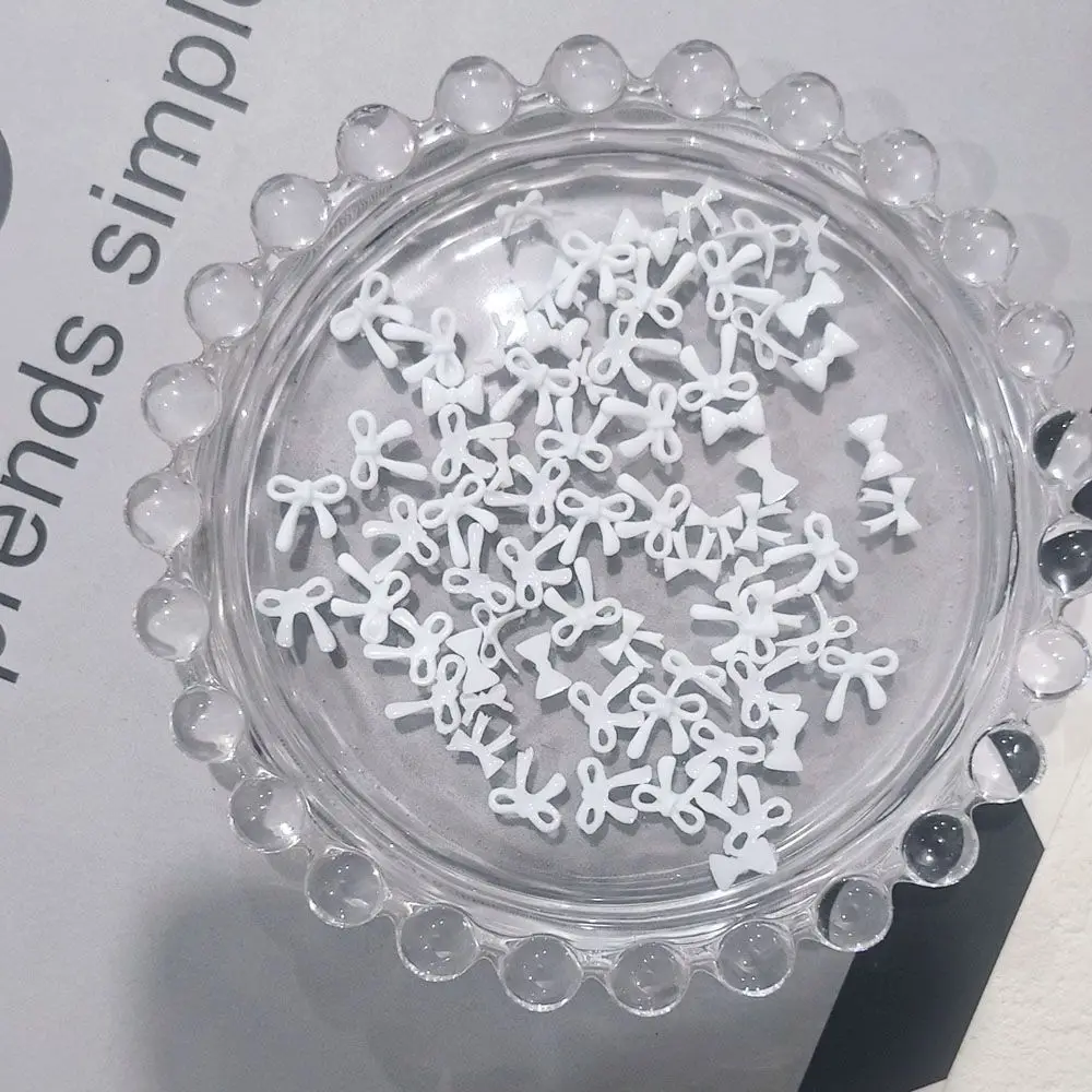 100 pièces/sac 3D mixte Muti Style blanc nœud papillon breloques pour ongles en vrac Mini ruban en résine Nail Art partie fille doux noeud papillon décoration des ongles