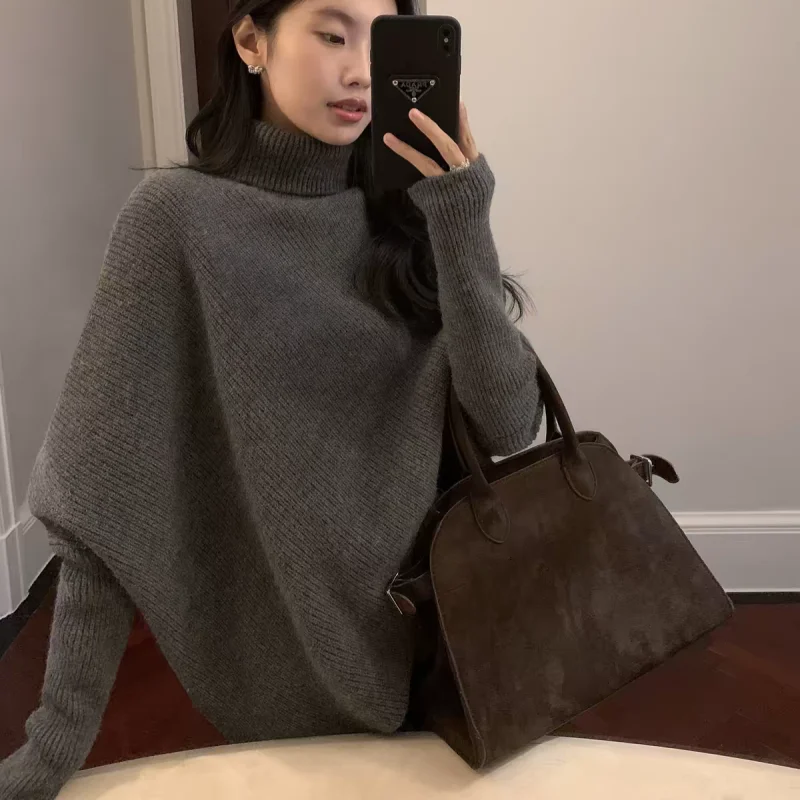 Autumn and winter 100% pure wool sweater design sense turtleneck bat sleeve sweater women's loose irregular cloak knitwear