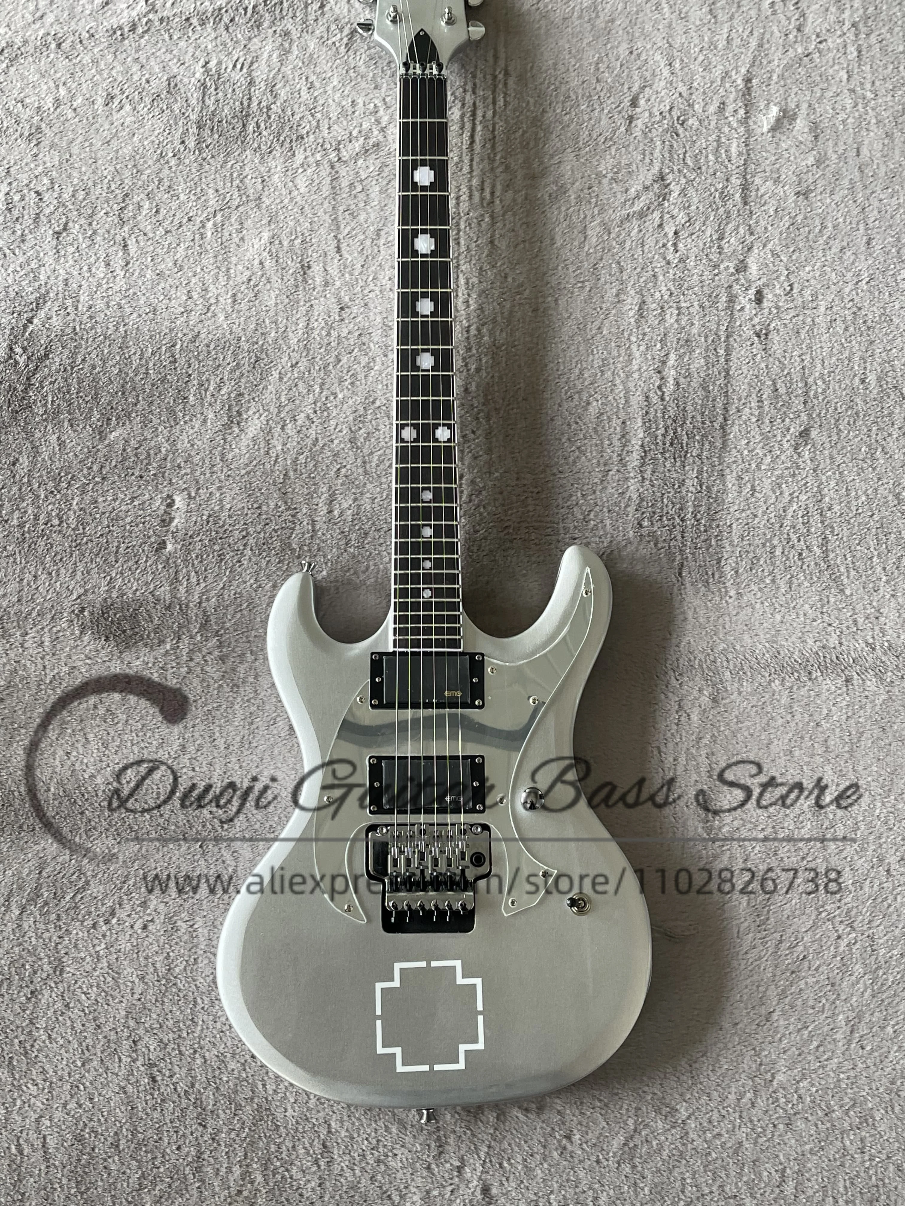

Silver guitar Tremolo bridge, maple neck Set In basswood body, rosewood fingerboard, cross-inlaid mirror guard