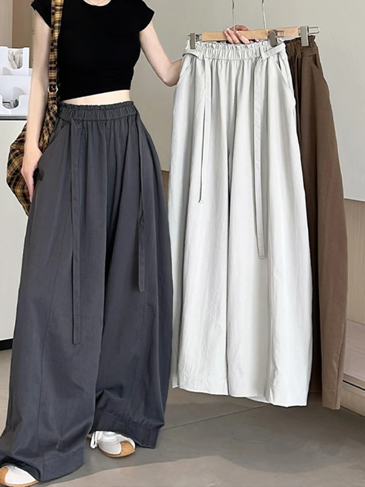 

Новые модные повседневные женские брюки с широкими штанинами, свободные, на шнуровке, летние, в корейском стиле, с высокой талией, оверсайз, элегантные, однотонные.