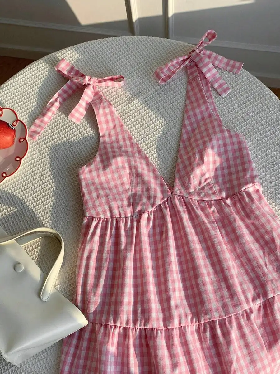 

Pink Gingham Sleeveless V-Neck Mini Dress With Tie Shoulder Straps And Ruffle Detail
