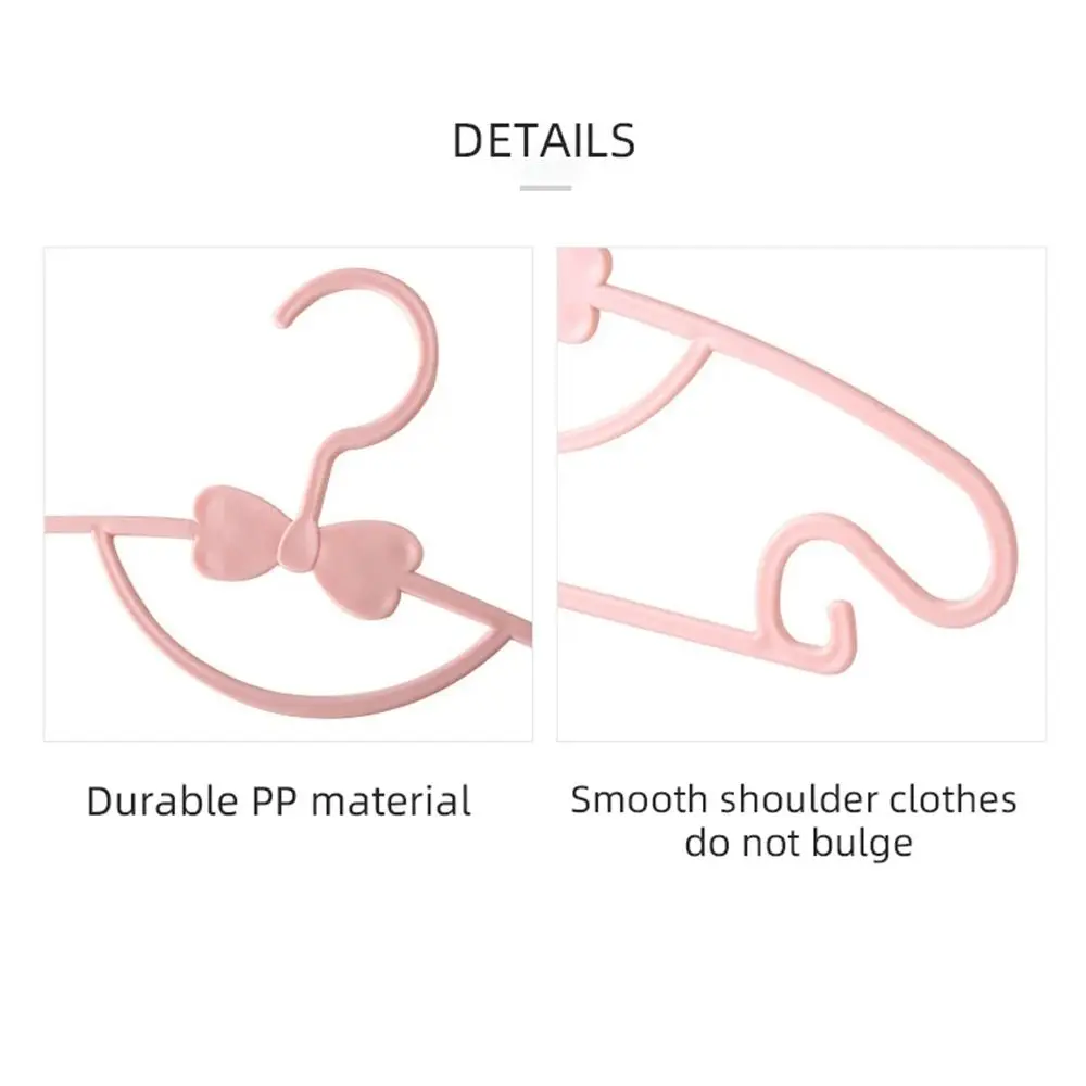 30 Uds. Percheros de Material plástico para ropa de bebé, bonito lazo, perchas portátiles para ropa para niños, organizador de armario grueso a prueba de viento, abrigos