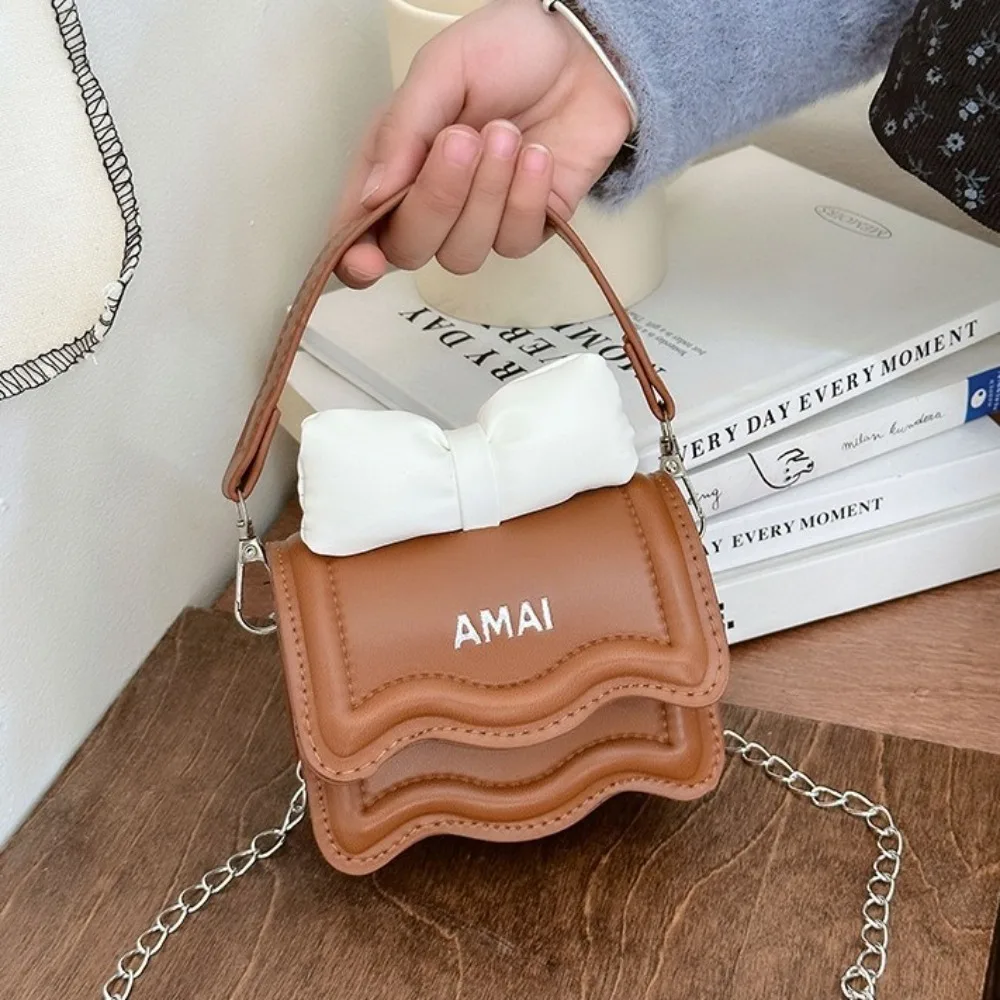 بلون صغير القوس حقيبة كروسبودي بو الجلود حقيبة مربعة صغيرة الحلو حقيبة كتف سلسلة حقيبة ساعي الأطفال حقيبة يد الأطفال