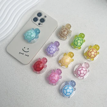 1PC Supporto per telefono tartaruga che si illumina al buio Mini design tartaruga in resina Supporto pieghevole espandibile Impugnatura ABS antiscivolo per dispositivi mobili