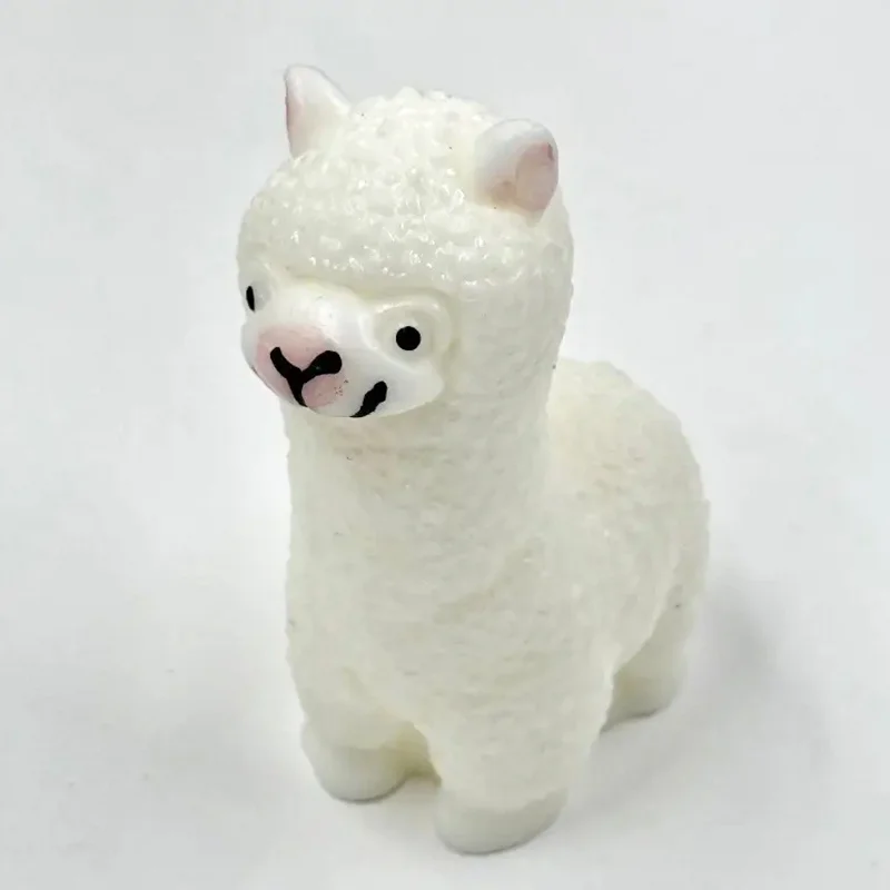 A Cartoon Little Sheep with Small White Ears, a White Short-Haired Goat, And a Lively Standing Goat Llama Squeeze Toy Made of Si