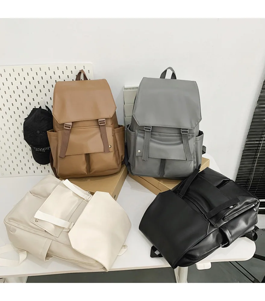 Simple casual PU women's bag large capacity double pocket couple backpack large capacity commuting versatile women's schoolbag