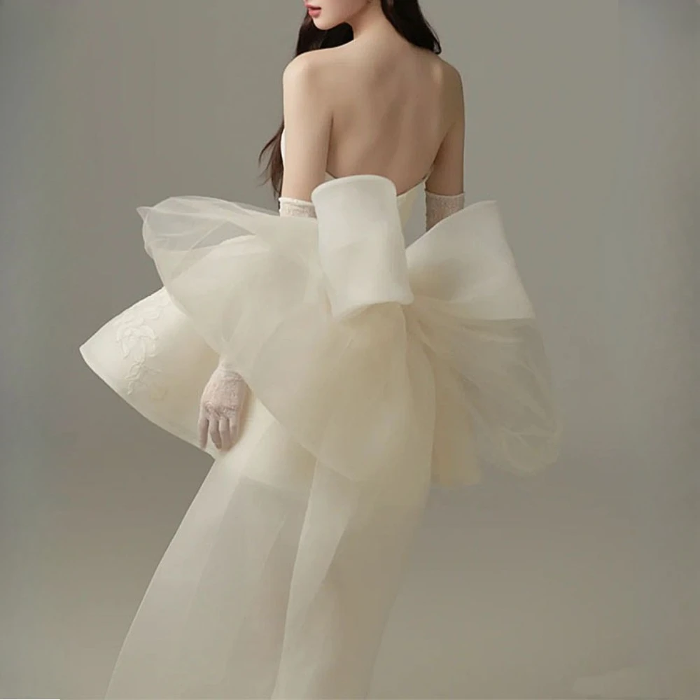 TWOTWINSTYLE solide épissé maille nœud papillon robes douces pour les femmes sans bretelles sans manches taille haute élégant Mini robe femme nouveau