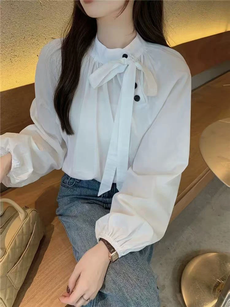 

Корейская шикарная женская блузка с диагональными пуговицами, весенняя свободная модель с бантом, на шнуровке, с длинным рукавом, универсальная рубашка с воротником-стойкой
