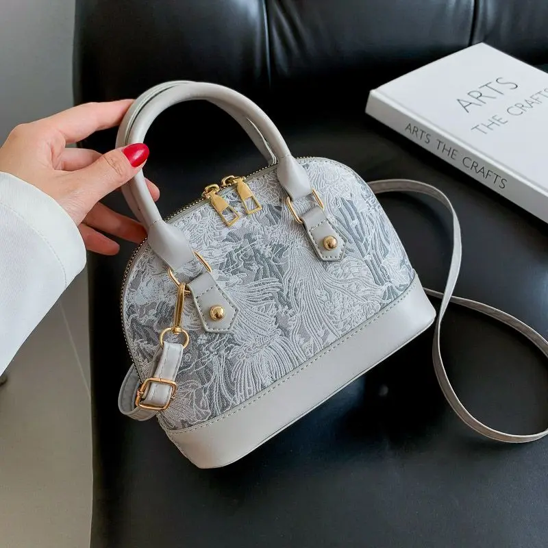 Wersja francuska niszowa popularna torebka damska nowa moda torebka z Pu koronkowa torba Crossbody wszechstronna torba z muszli wyszywana torba na
