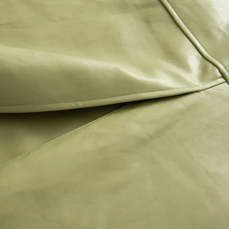 เสื้อโค้ทกันลมหนังยาวสีพื้นทรงหลวมประดับเข็มขัดที่ไหล่  คอลเลคชั่นฤดูใบไม้ร่วงใหม่สำหรับผู้หญิงจาก KEYANKETIAN