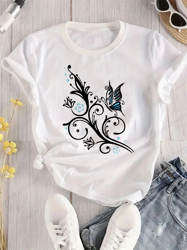 Camiseta de mariposa azul con flores voladoras para mujer, camiseta deportiva elegante con estampado, transpirable, ajuste cómodo, parte superior blanca perfecta para todas las estaciones