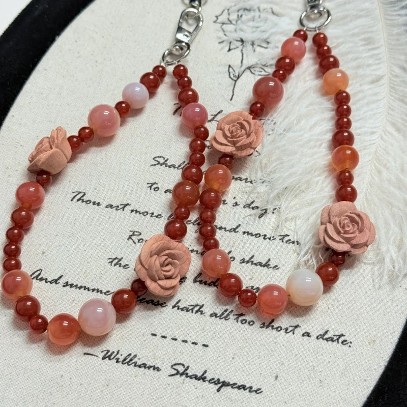 

Natural red agate, Yanyuan agate, blood cedar wood, rose flower handmade beaded phone charm, bag pendant, stylish and versatile