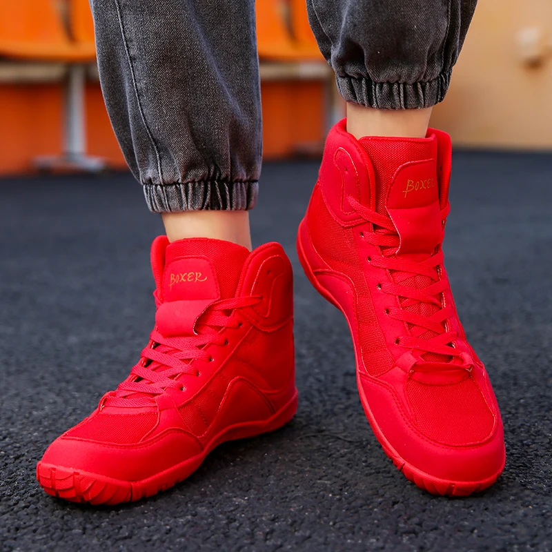 รองเท้ามวยปล้ํามืออาชีพ (ผู้ชายผู้หญิง) รองเท้ากีฬาน้ําหนักเบาหลากสี (สําหรับการชกมวยและการฝึกซ้อมกลางแจ้ง)