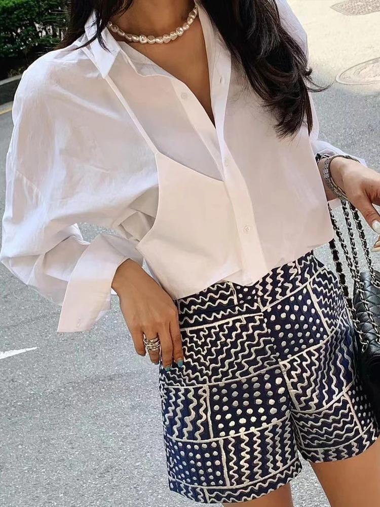 

Новая женская белая блузка с асимметричным дизайном, имитирующая двухслойность, с длинными рукавами и бретелями, без заутюживания, устойчивая к старению, модная весенняя коллекция