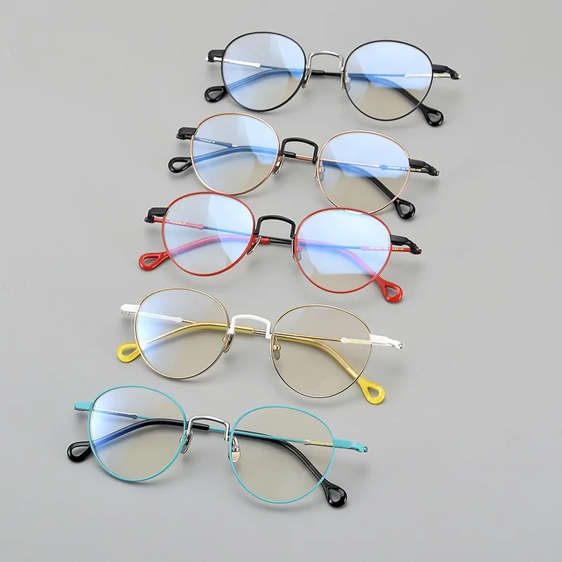 الاتجاه الجديد مصمم التيتانيوم النقي البيضاوي إطارات النظارات أزياء النساء النظارات بسيطة المتخصصة البصرية وصفة طبية إطارات النظارات