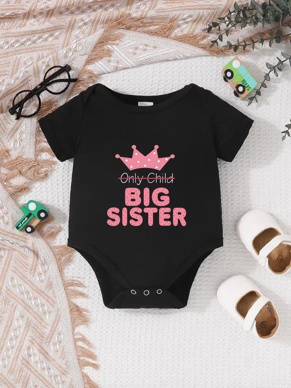 

Playful letter-printed baby short-sleeve triangle bodysuit. Button closure for easy dressing