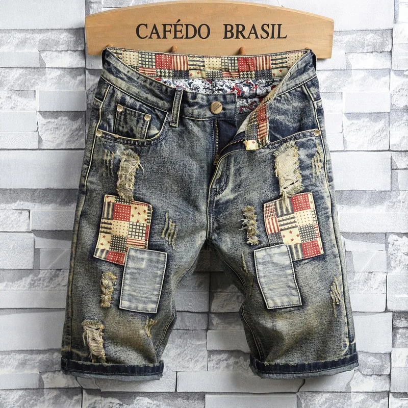 2024 pantaloncini di Jeans da moto da uomo di marca di moda estiva con cuciture Patchwork pantaloni corti di Jeans strappati retrò dritti larghi