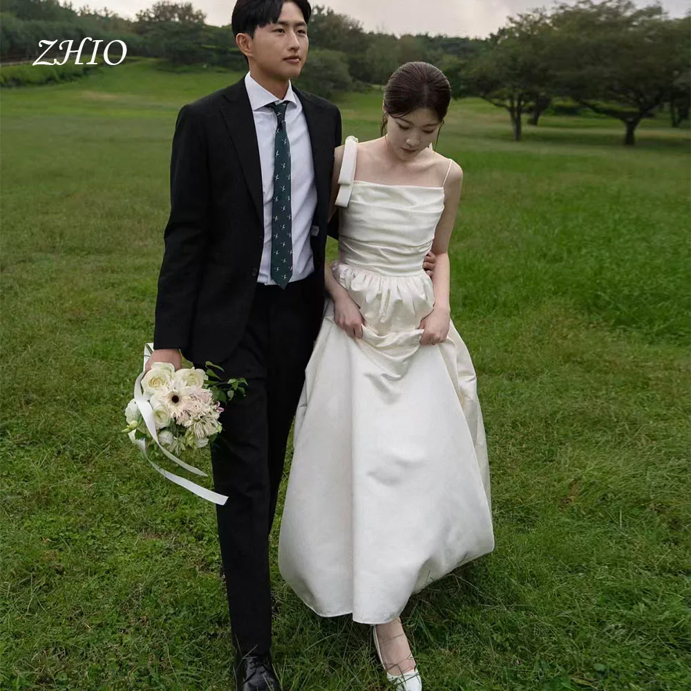 ZHIO بسيط القوس السباغيتي الأشرطة فستان حفلات الزفاف العاج الساتان ألف خط كوريا صورة تبادل لاطلاق النار فستان استقبال الزفاف مخصص