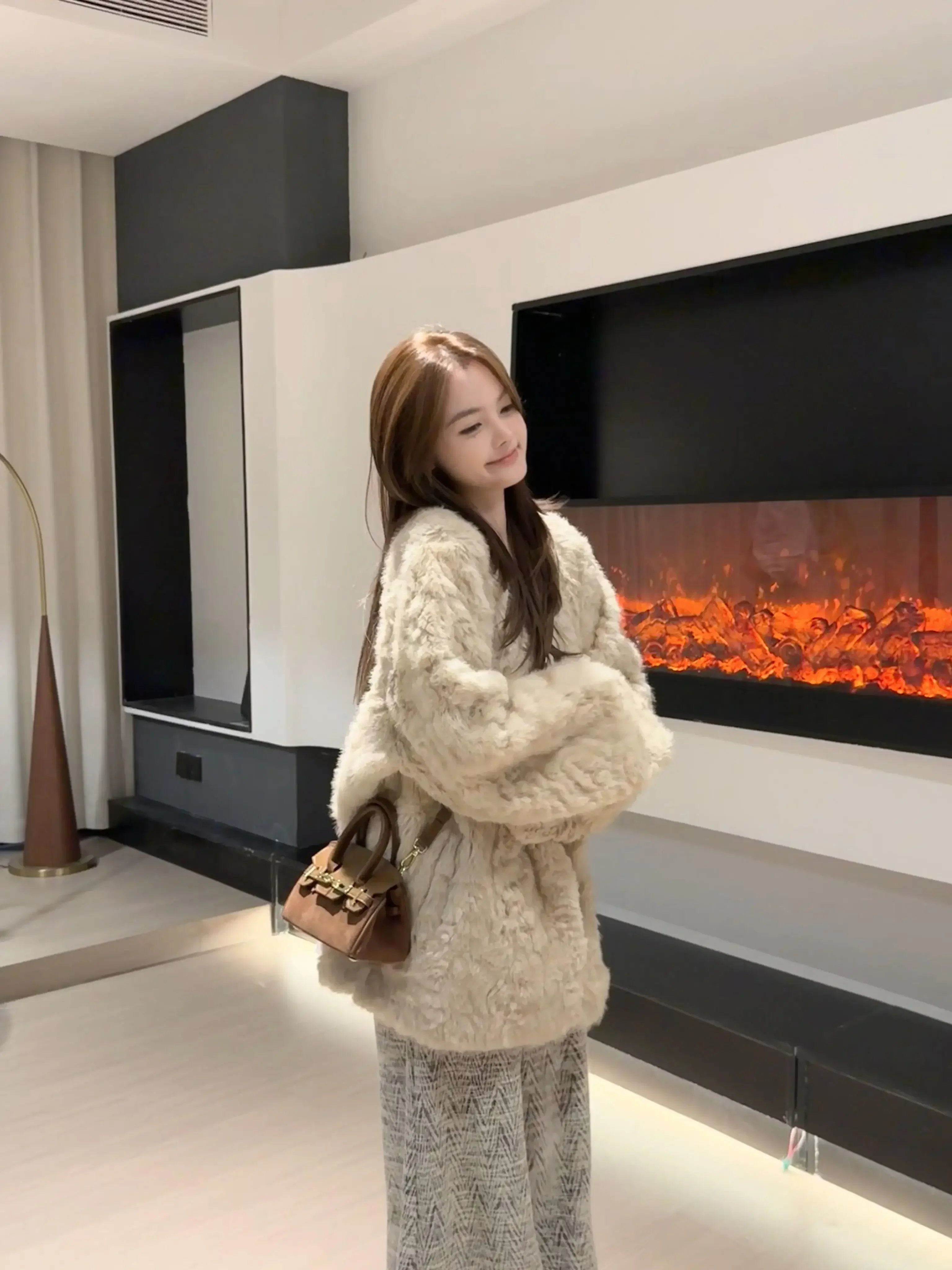 Style d'hiver épaissi chaud simple boutonnage nouvelle laine d'agneau fourrure intégrée femmes manteau veste couleur unie mi-longue ample décontracté