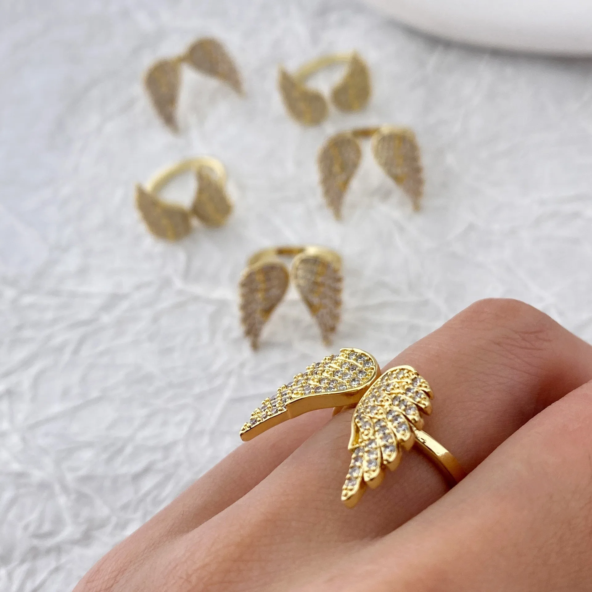 

A bestseller, a zircon gold angel wing adjustable live ring for women set with full diamonds