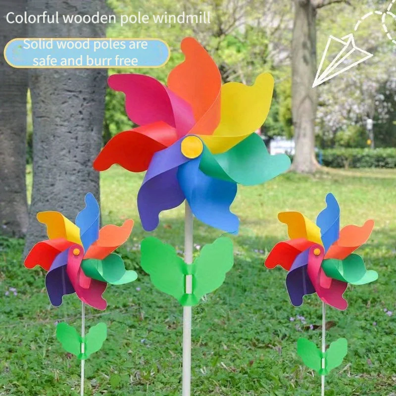 Colorful windmill outdoor decoration festival scenic park children holding rotating wooden color windmill