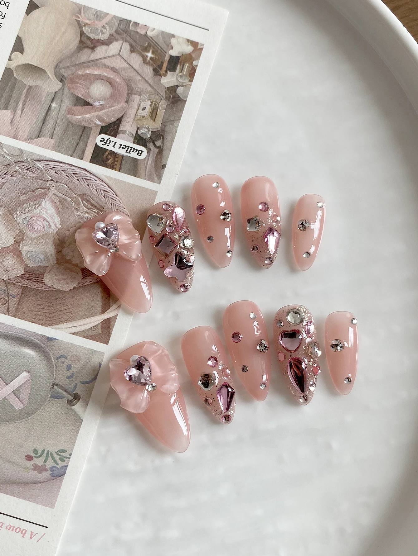 Long Stiletto Press‑On Nails, Natural Nude Pink Base, Handcrafted 3D Bow Ornament & Assorted Pink Heart Crystal Rhinestones