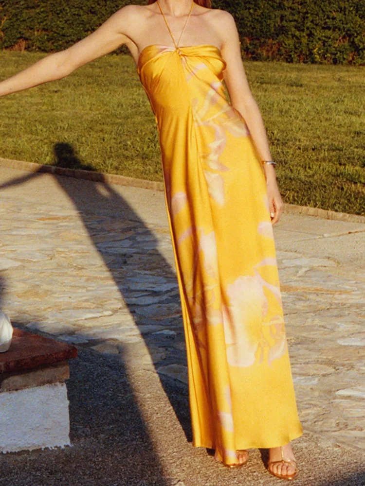 2025年夏新作 イエロー プリント サテンワンピース ノースリーブ ハンギングネック バックレス ロングスカート セクシー スタイル ファッションと快適さを兼ね備えたドレス
