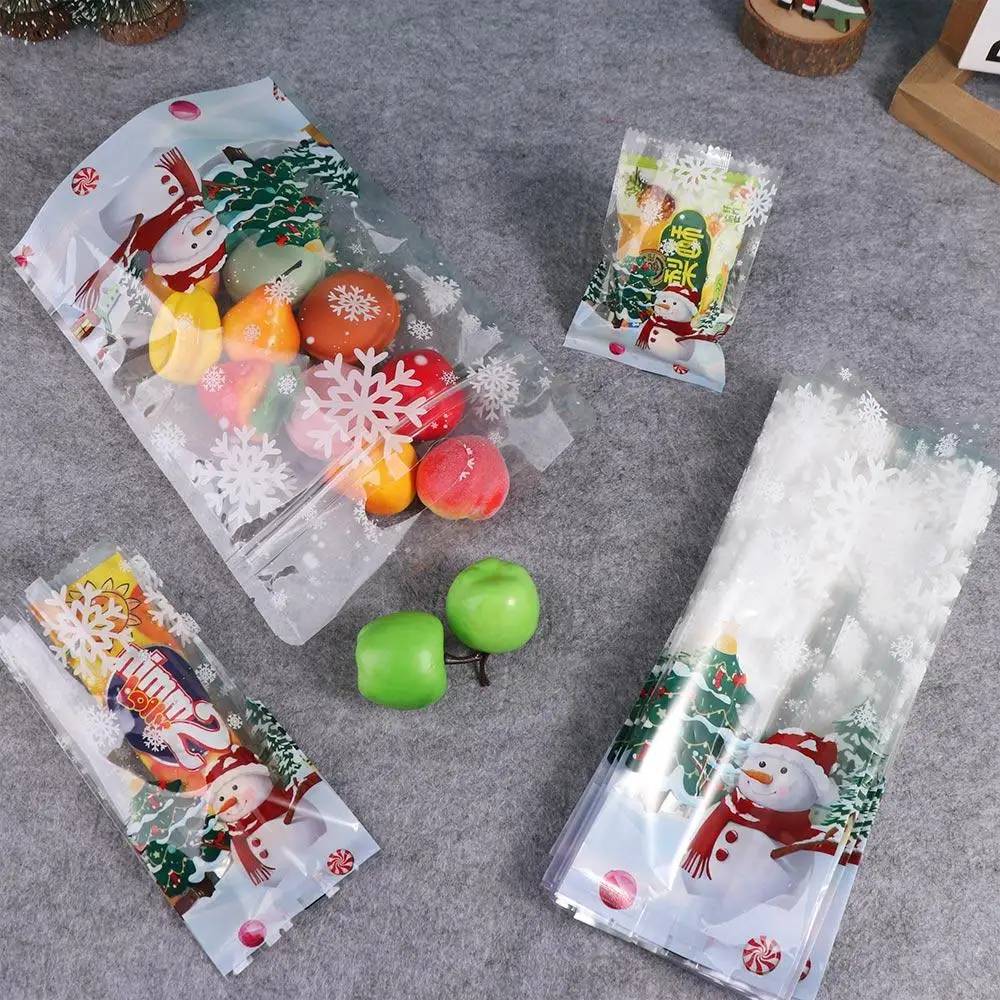 50 pçs sacos de biscoitos de plástico transparente de natal engrossado boneco de neve floco de neve padrão cozimento sacos de embalagem de doces presentes de natal