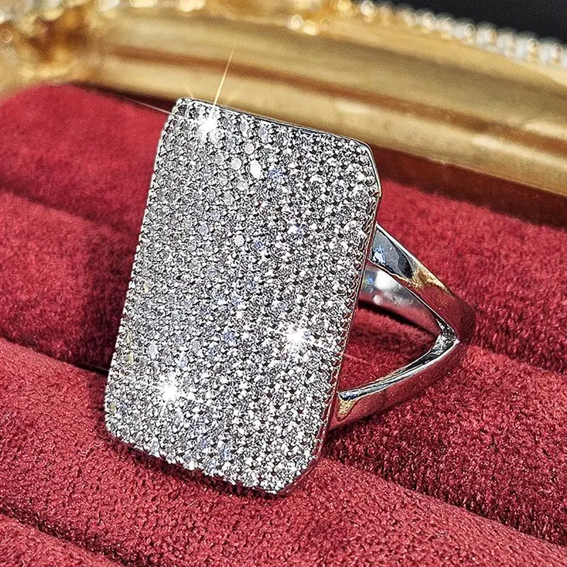 Huitan Funkelnder geometrischer Ring für Damen, voller brillanter Zirkonia, modisches Hochzeits- und Party-Zubehör, eleganter Luxusschmuck