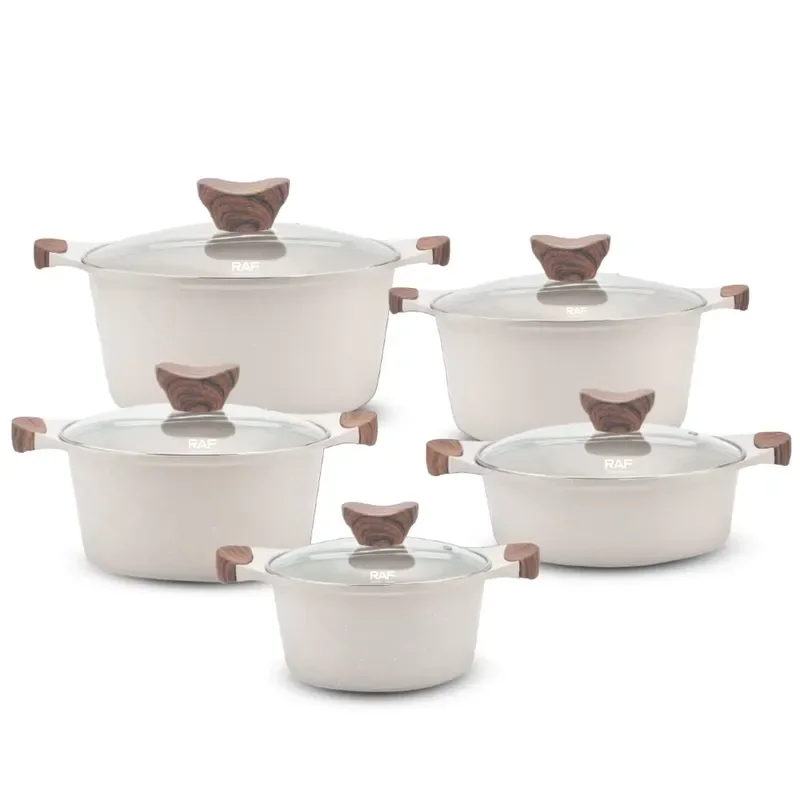 Non-stick kitchen utensils set includes pots and pans with lids, black/white cookware set.