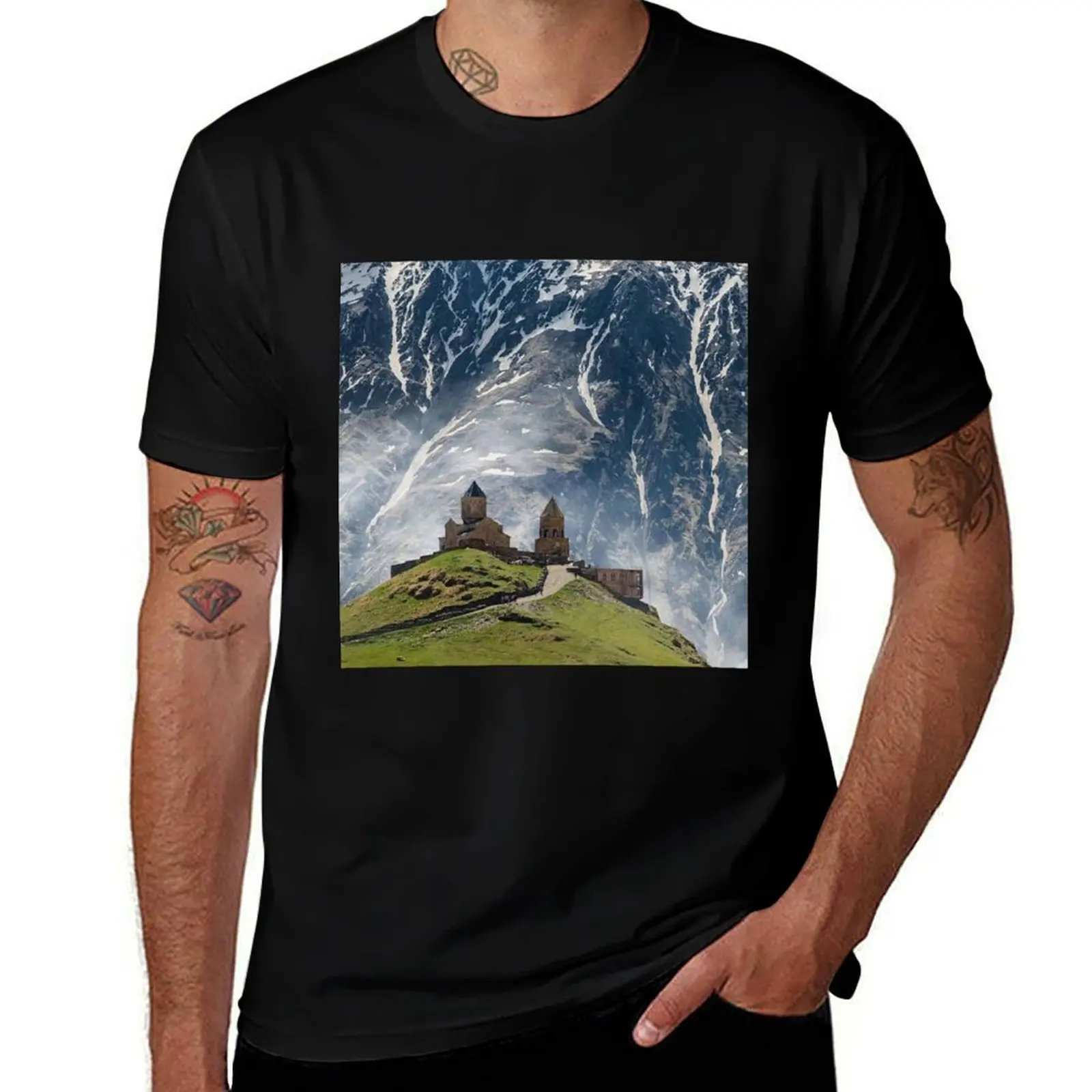 

Gergeti Trinity Church Georgia, Caucasus Mountain as a back drop T-Shirt t shirts for man graphic cars man t shirts for men