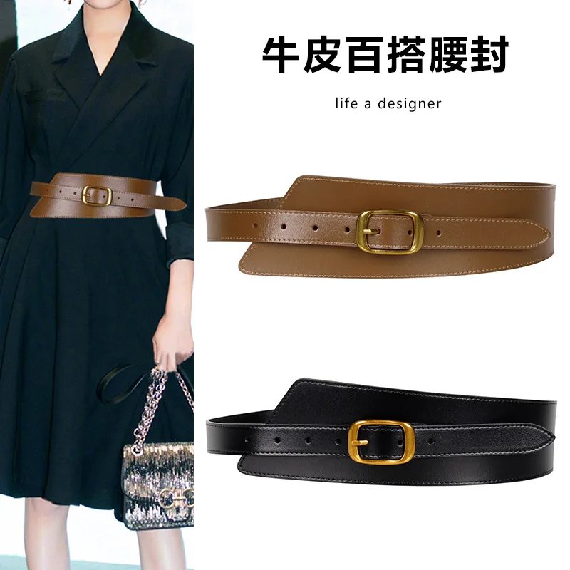 

Women's coat with wide leather belt, decorative sweater paired with dress, outer blazer with cinched waist belt