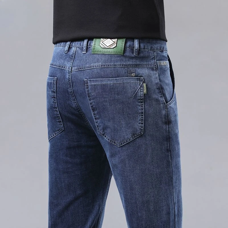 Moda masculina calças de brim retas novo estiramento fino ajuste calças confortáveis macio negócios denim calças masculinas roupas marca