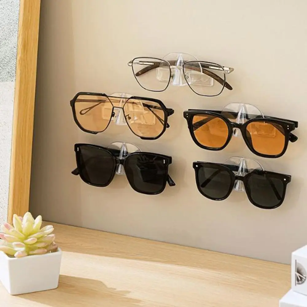 

10Pcs Clear Glasses Storage Rack Self Adhesive Traceless Glasses Wall Holder Plastic Space Saving Glasses Display Holder