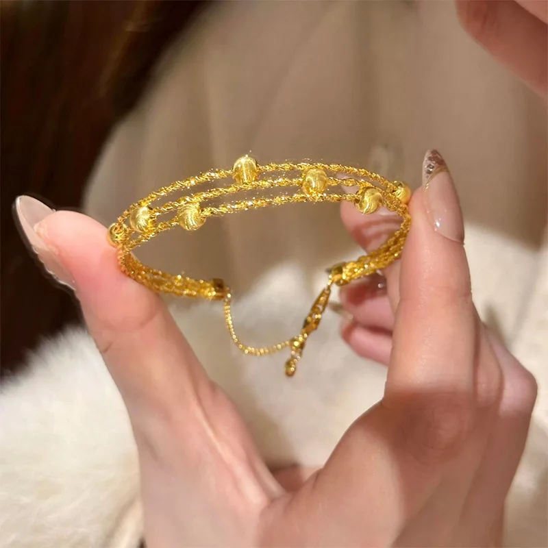 women glitter three-strand woven cat eye gold bangle crafted from 24K pure gold AU999 is top-selling woven gold bangle