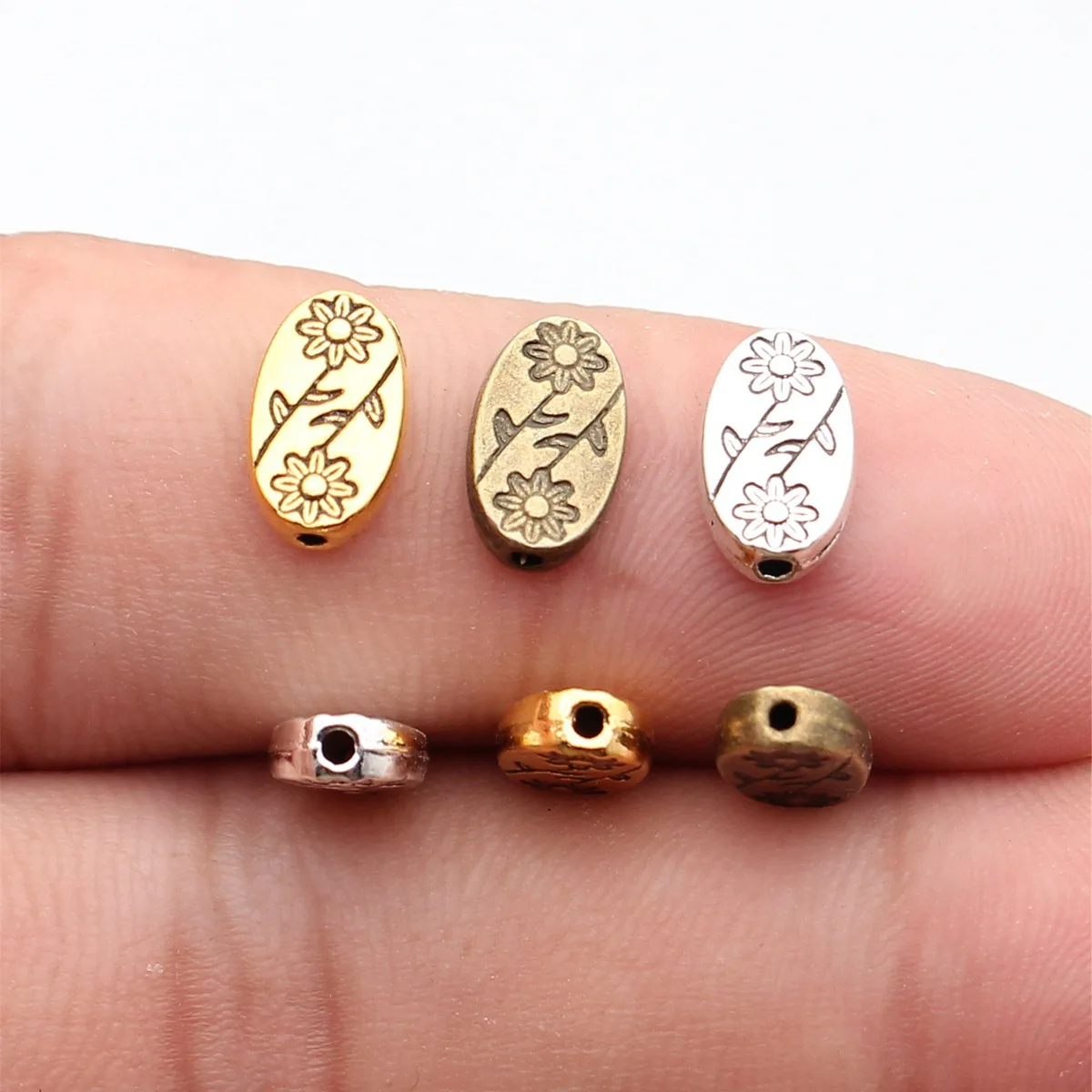 20 cuentas de 10x6x3mm con dijes de flores de Color plateado antiguo, cuentas de flores ovaladas, cuentas espaciadoras con agujeros pequeños